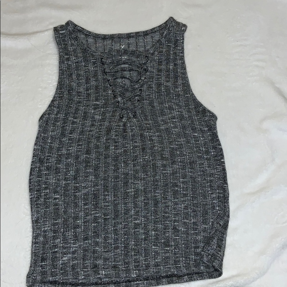 a cute crop top with a criss cross v neck